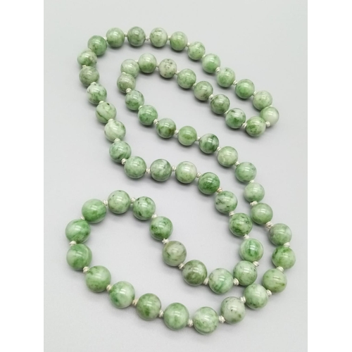 228 - Green natural Jade beaded chain individually knotted 80cm long and 10-12mm beads approx