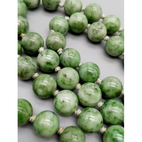 228 - Green natural Jade beaded chain individually knotted 80cm long and 10-12mm beads approx