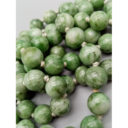 228 - Green natural Jade beaded chain individually knotted 80cm long and 10-12mm beads approx