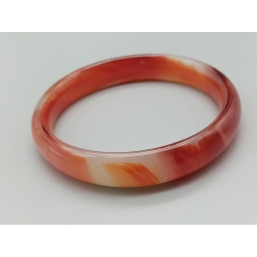 789 - Red jade bangle weight 38g and 7cm inner diameter