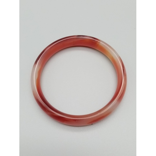 789 - Red jade bangle weight 38g and 7cm inner diameter