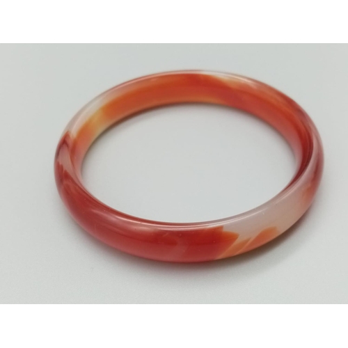 789 - Red jade bangle weight 38g and 7cm inner diameter