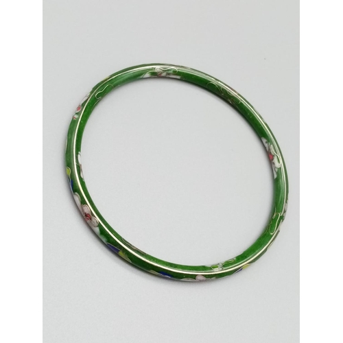 813 - Vintage enamel bangle with floral design 7.5cm diameter