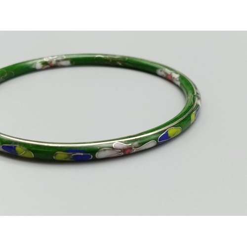 813 - Vintage enamel bangle with floral design 7.5cm diameter