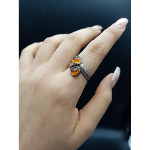 580 - Cross over amber silver ring size N