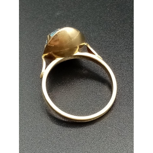 328 - 9k yellow gold ring with large blue stone setting, weight 4.8g and size Q