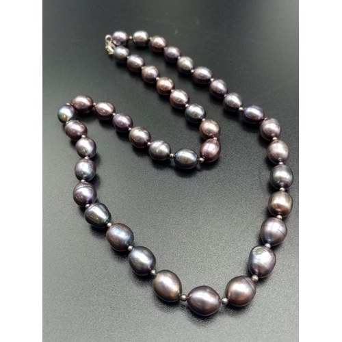 553 - Dark colour pearl necklace silver clasp baroque shape various shades 46cm long