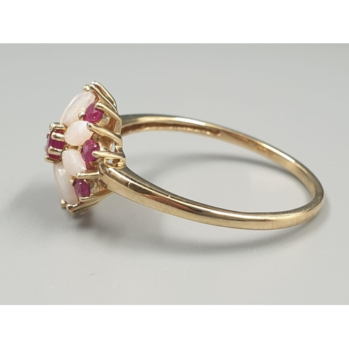 109 - 9K YELLOW GOLD VINTAGE OPAL AND RUBY CLUSTER RING FLOWER DESIGN, WEIGHT 2.2G SIZE U