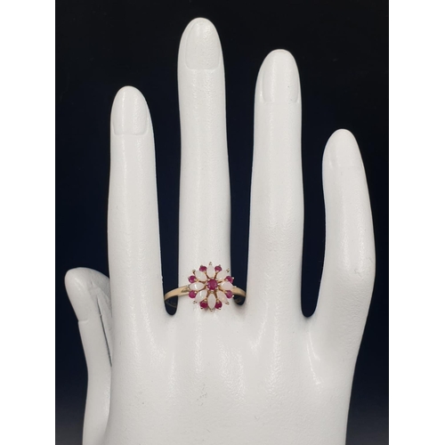 109 - 9K YELLOW GOLD VINTAGE OPAL AND RUBY CLUSTER RING FLOWER DESIGN, WEIGHT 2.2G SIZE U