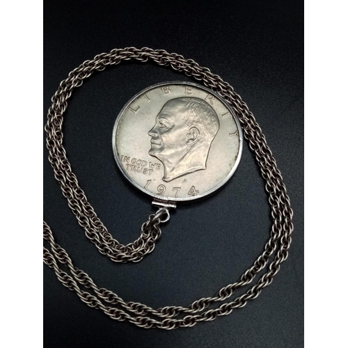 763 - 1974 Liberty 1 Dollar USA coin pendant set in silver chain, 68cm long approx