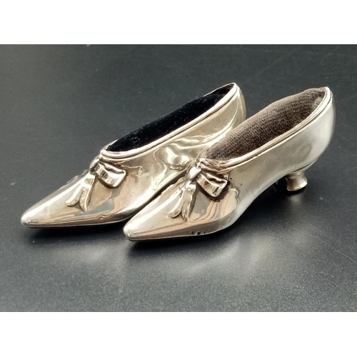 226 - Victorian silver set of a swan and a pair of shoes cushion pins , total weight 93.7g