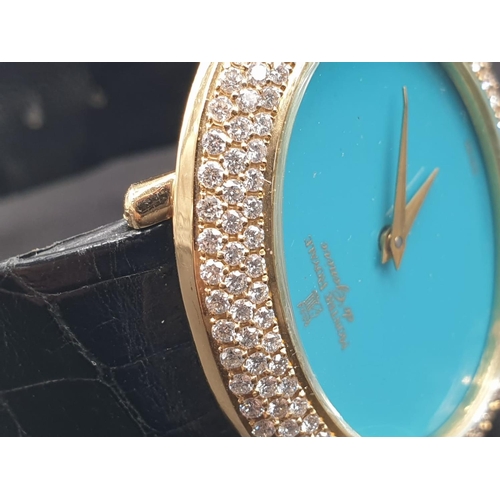 122 - A MONTRE ROYALE OF GENEVA LADIES 18K GOLD DRESS WATCH WITH DIAMOND BEZEL AND TURQUOISE FACE. 36mm