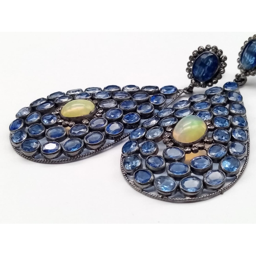 26 - An impressive pair of drop Earrings set with over 30cts Kyanites and 6cts of Fire Opals, approx 7.5c... 