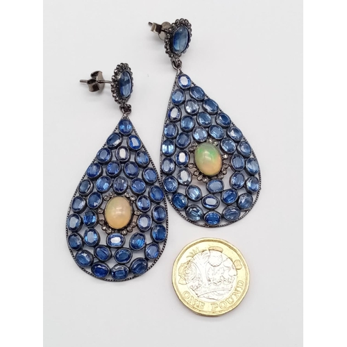 26 - An impressive pair of drop Earrings set with over 30cts Kyanites and 6cts of Fire Opals, approx 7.5c... 