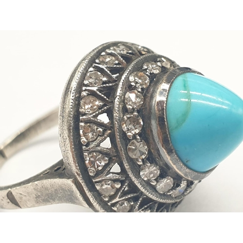 278 - AN ANTIQUE SILVER RING WITH DIAMONDS AND TURQUOISE IN AN ART DECO STYLE.
5.8gms AND SIZE G