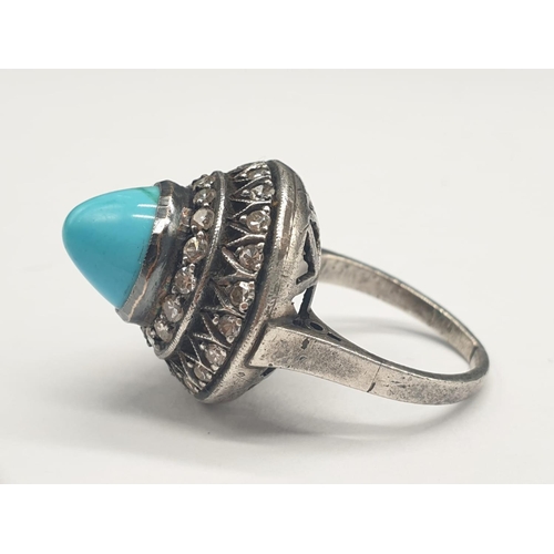 278 - AN ANTIQUE SILVER RING WITH DIAMONDS AND TURQUOISE IN AN ART DECO STYLE.
5.8gms AND SIZE G