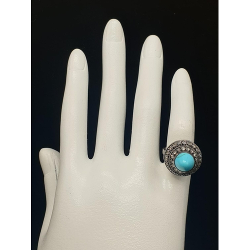 278 - AN ANTIQUE SILVER RING WITH DIAMONDS AND TURQUOISE IN AN ART DECO STYLE.
5.8gms AND SIZE G