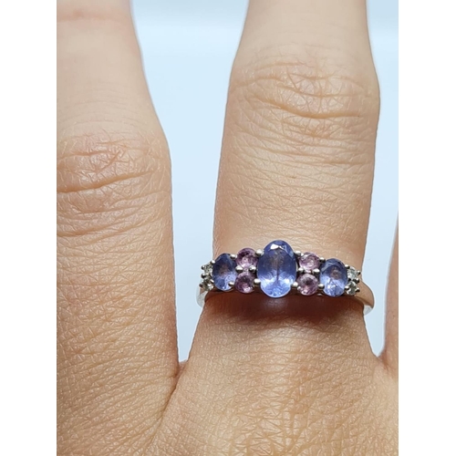 299 - 9K WHITE GOLD DIAMOND, PINK SAPPHIRE AND IOLITE RING WEIGHT 2G SIZE N1/2