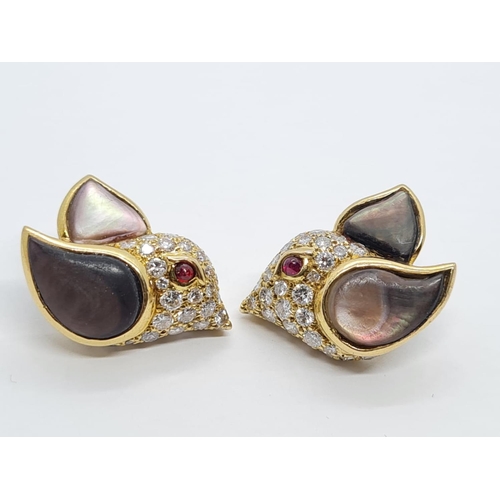 310 - A PAIR OF 18K DIAMOND EARRINGS SHAPED LIKE FLYING BIRDS WITH BLACK PEARL WINGS AND RUBY EYES.  8.3gm... 