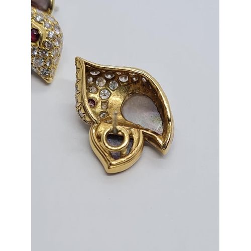 310 - A PAIR OF 18K DIAMOND EARRINGS SHAPED LIKE FLYING BIRDS WITH BLACK PEARL WINGS AND RUBY EYES.  8.3gm... 