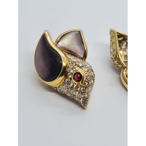 310 - A PAIR OF 18K DIAMOND EARRINGS SHAPED LIKE FLYING BIRDS WITH BLACK PEARL WINGS AND RUBY EYES.  8.3gm... 