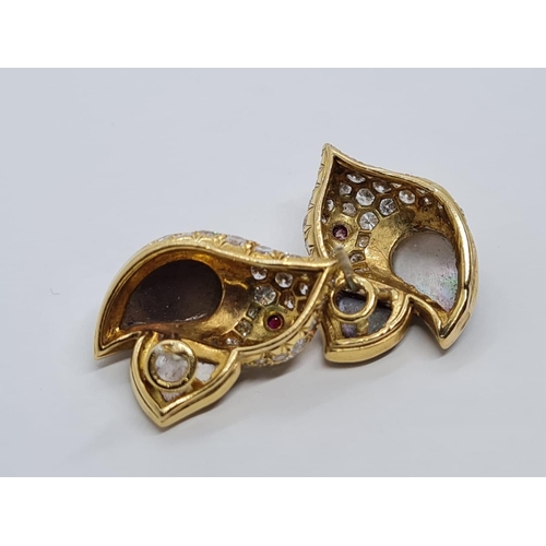 310 - A PAIR OF 18K DIAMOND EARRINGS SHAPED LIKE FLYING BIRDS WITH BLACK PEARL WINGS AND RUBY EYES.  8.3gm... 