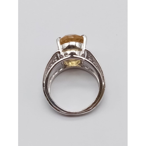 540 - An 11ct citrine sterling silver ring, stamped 925 size U