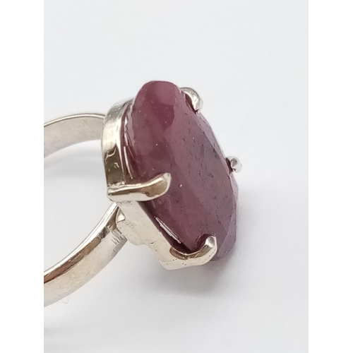 554 - A sterling silver gemstone ring set with 11ct natural red ruby, oval cut, hallmarked, 9g total weigh... 