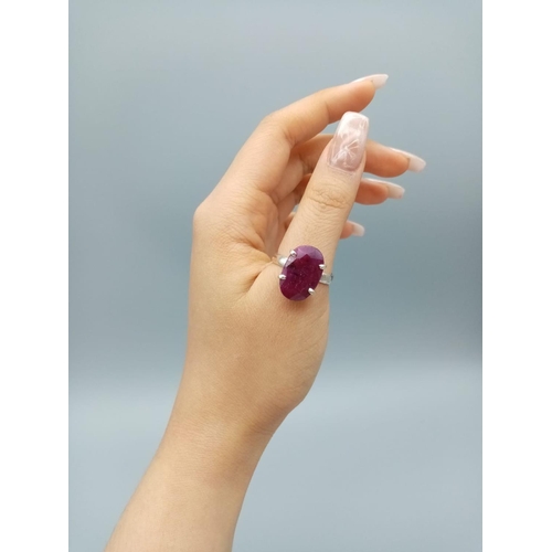 554 - A sterling silver gemstone ring set with 11ct natural red ruby, oval cut, hallmarked, 9g total weigh... 