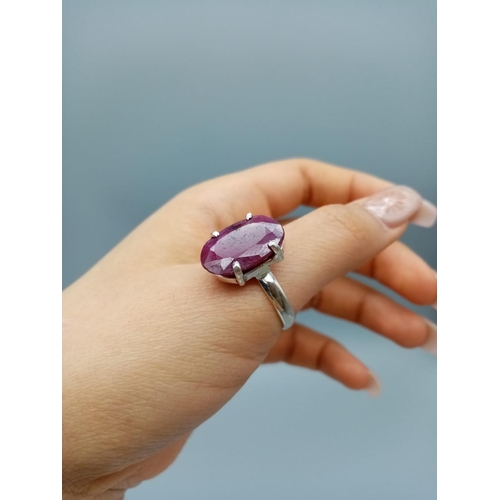 554 - A sterling silver gemstone ring set with 11ct natural red ruby, oval cut, hallmarked, 9g total weigh... 