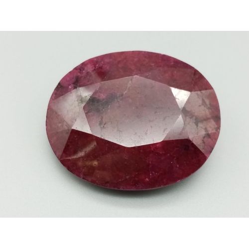 593 - A large 295ct natural ruby gemstone, oval cut, with GLI certification