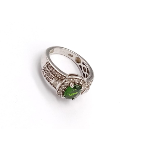 672 - STERLING SILVER GREEN STONE AND CZ DRESS RING WEIGHT 4.5G SIZE L1/2