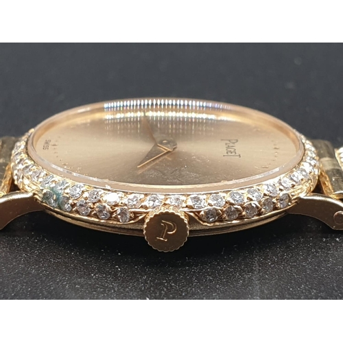 129 - AN 18K GOLD PIAGET LADIES WRIST WATCH WITH DIAMOND BEZEL AND SOLID GOLD STRAP.
manual movement  25mm... 