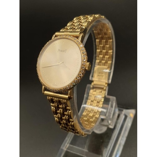 129 - AN 18K GOLD PIAGET LADIES WRIST WATCH WITH DIAMOND BEZEL AND SOLID GOLD STRAP.
manual movement  25mm... 