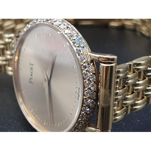 129 - AN 18K GOLD PIAGET LADIES WRIST WATCH WITH DIAMOND BEZEL AND SOLID GOLD STRAP.
manual movement  25mm... 