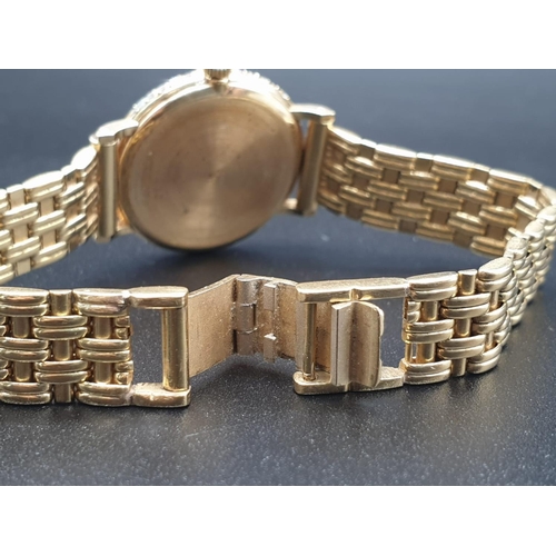 129 - AN 18K GOLD PIAGET LADIES WRIST WATCH WITH DIAMOND BEZEL AND SOLID GOLD STRAP.
manual movement  25mm... 