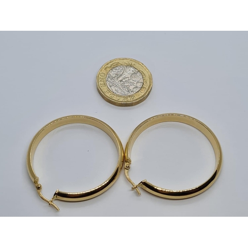 297 - Pair of 16k yellow gold big hoop earrings, weight 4.4G and 38mm diameter approx