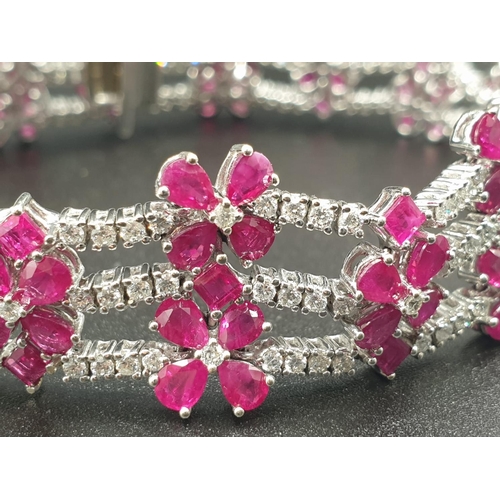 303 - AN EXTREMELY ATTRACTIVE 3 ROW 18K WHITE GOLD BRACELET WITH ENCRUSTED DIAMONDS AND DECORATED WITH  A ... 