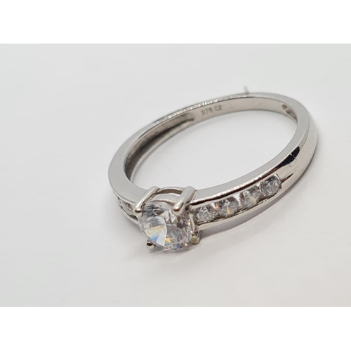 311 - 9K WHITE GOLD CZ STONE SET DRESS RING, WEIGHT 2G AND SIZE L