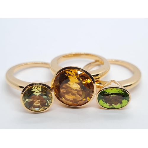 342 - a set of 3 18k yellow gold rings size n with different semi precious coloured stones
26.3gms