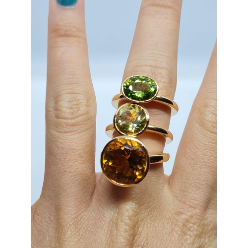 342 - a set of 3 18k yellow gold rings size n with different semi precious coloured stones
26.3gms