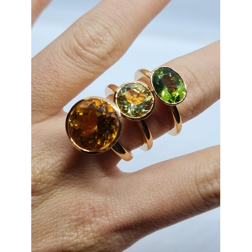 342 - a set of 3 18k yellow gold rings size n with different semi precious coloured stones
26.3gms