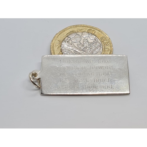 404 - STERLING SILVER INGOT PENDANT WITH MESSAGE ABOUT TAKING STEPS FORWARD WEIGHT 4.8G AND 3.5CM LONG