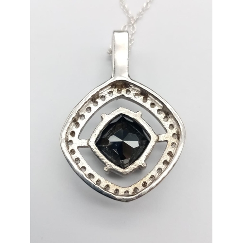 558 - A 4ct black moissanite gemstone pendant surrounded by rose cut diamonds and set in sterling silver, ... 