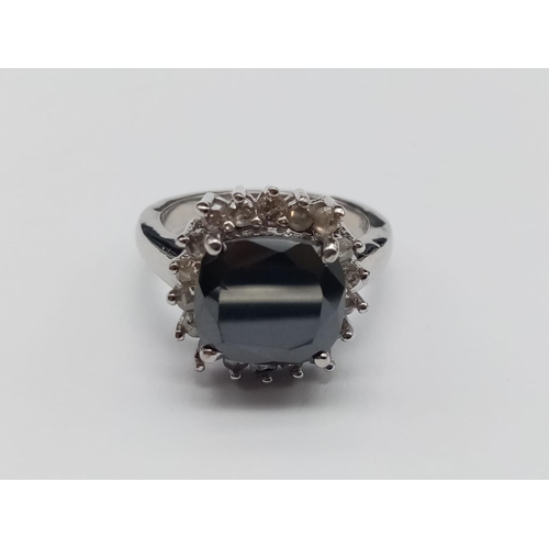 558 - A 4ct black moissanite gemstone pendant surrounded by rose cut diamonds and set in sterling silver, ... 