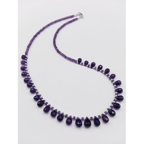 600 - An amethyst drops necklace, with alternate seed pearl, length 18