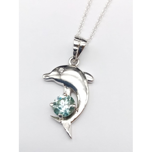 565 - A matching set of moissanite gemstone jewellery including a 0.7ct dolphin pendant and a 0.3ct blue m... 