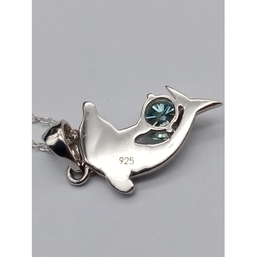 565 - A matching set of moissanite gemstone jewellery including a 0.7ct dolphin pendant and a 0.3ct blue m... 