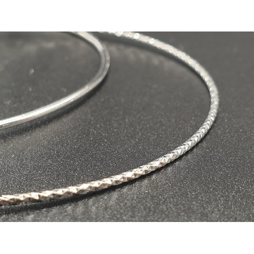 284 - STERLING SILVER DOUBLE BANGLE WITH 3 CHARMS WEIGHT 9.3G AND 7.5CM DIAMETER