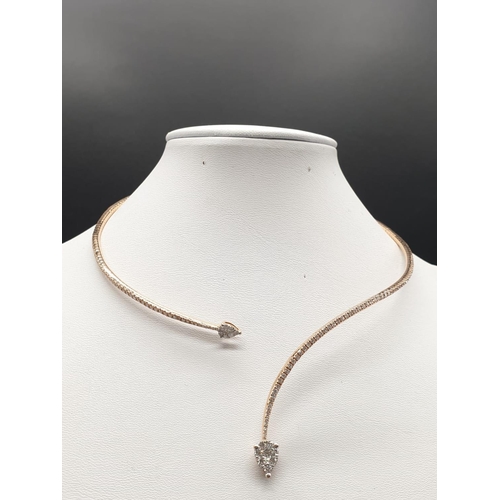 314 - AN  18K ROSE GOLD DIAMOND ENCRUSTED CHOKER NECK PIECE IN SNAKE FORM.
24.2gms approx 38cms long